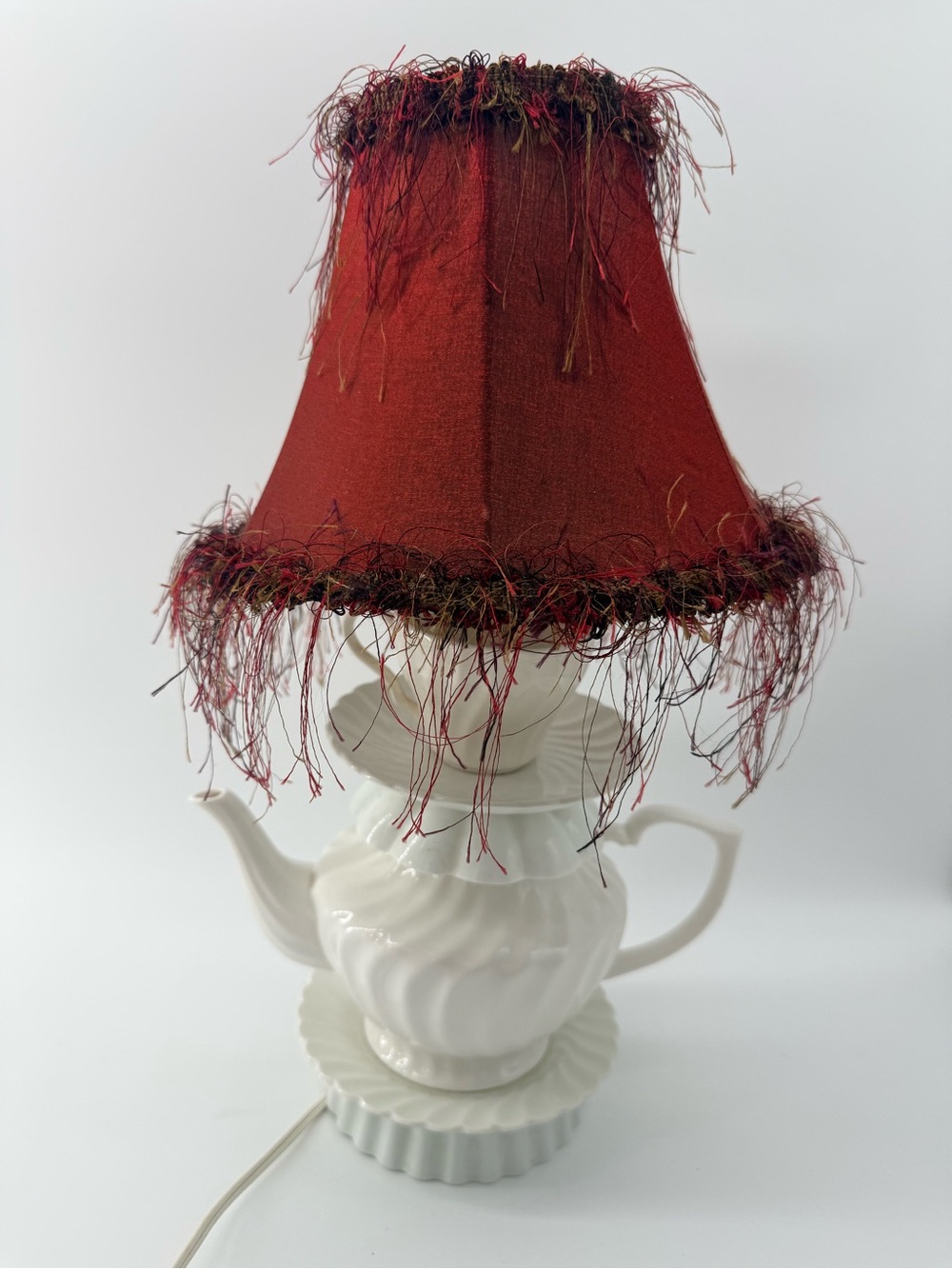 Vintage- style decorative table lamp crafted white ceramic teapot and saucer.